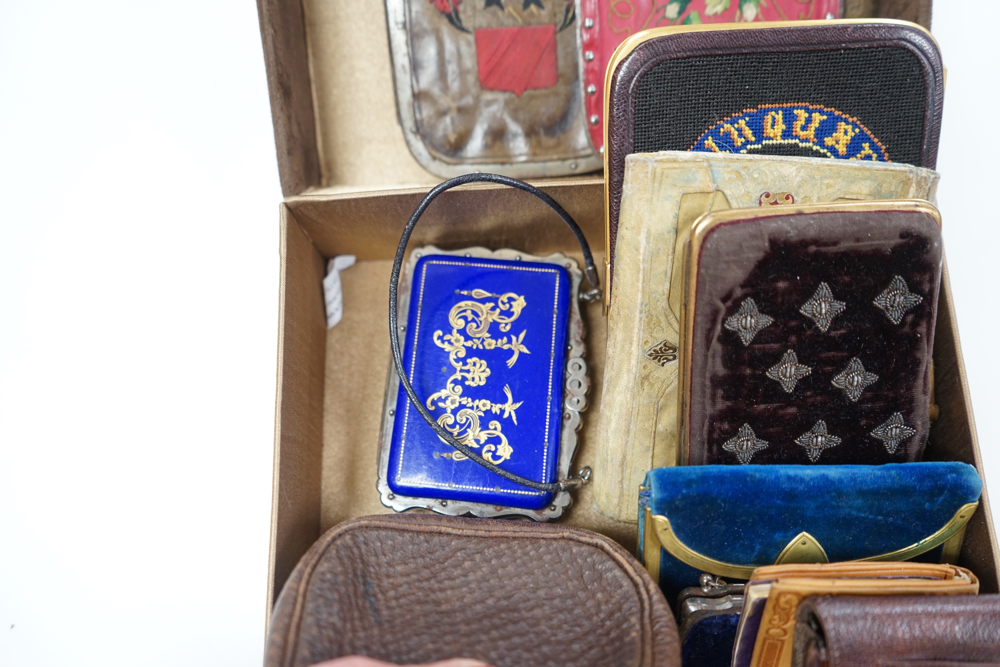 A collection of early 19th century and later embroidered, petite point, leather cut steel and velvet purses card cases etc